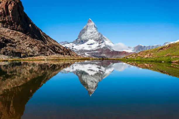 Riffelsee lake and Matterhorn mountain in the Alps, located between Switzerland and Italy