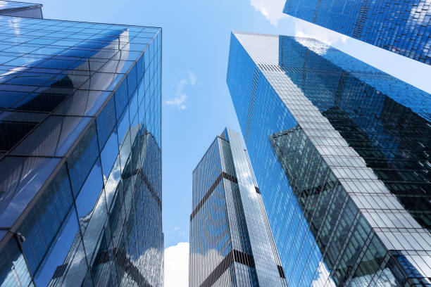 istock Bottom view of modern skyscrapers in business district. 1402489927