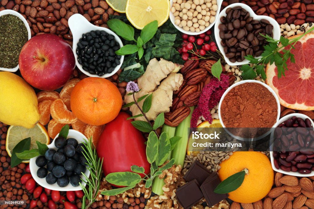 Health Food for a Healthy Heart Composition Health food for a healthy heart high in flavonoids, polyphenols, fibre, protein. Also high in antioxidants, anthocyanins, vitamins, bioflavonoids, minerals, lycopene. Flat lay. Antioxidant Stock Photo