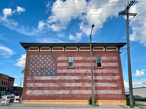 Old Brick Building With American Flag Painted On