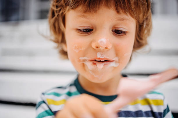 istock Toddler enjoying ice cream 1402496862