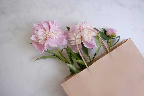 istock Beautiful peony flower in a paper bag 1402498192