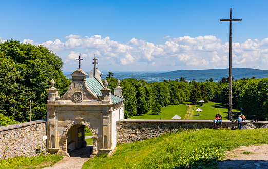 Swiety Krzyz, Poland - June 5, 2022: Lysa Gora, Swiety Krzyz mount hilltop with gate to medieval Benedictive Abbey and sanctuary in Swietokrzyskie Mountains near Nowa Slupia village