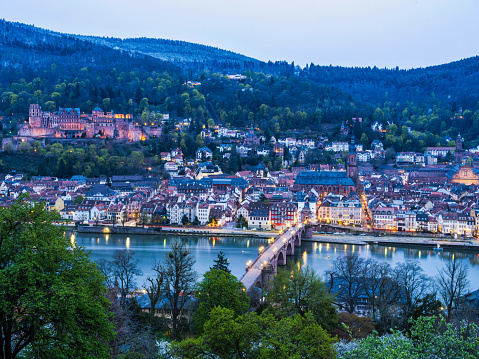 Long exposure shot of Heidelberg old town and Palace illuminated after sunset in Germany