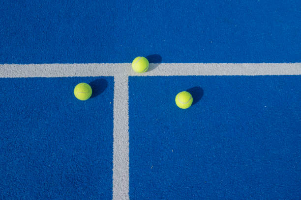 istock three paddle tennis balls on a blue court 1402501744