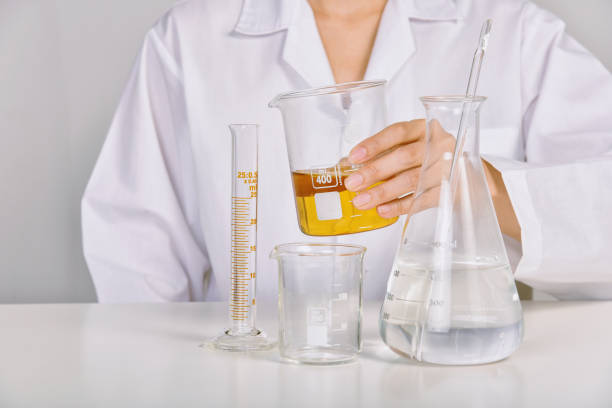 istock Scientist holding oil beaker, Laboratory and science experiments, Formulating the chemical for medical research, Quality control of petroleum industry products concept. 1402502731