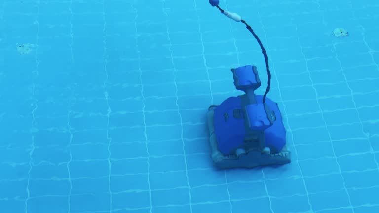 A robotic vacuum cleaner cleans the bottom of the pool