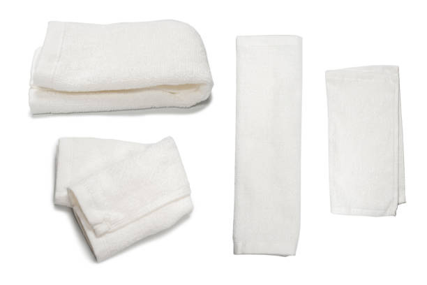 istock White fluffy cotton towel isolated on a white background. 1402504429