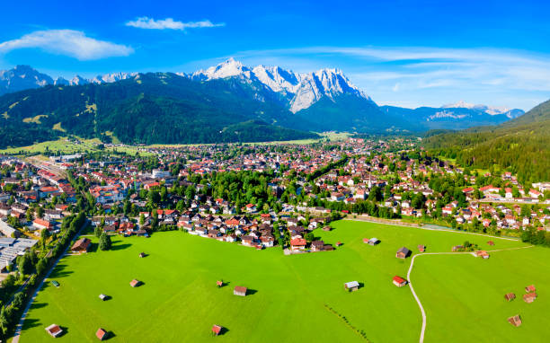 Garmisch-partenkirchen town aerial panoramic view, Germany Garmisch-partenkirchen and Zugspitze mountain aerial panoramic view. Garmisch Partenkirchen is an Alpine ski town in Bavaria, southern Germany. zugspitze mountain stock pictures, royalty-free photos & images