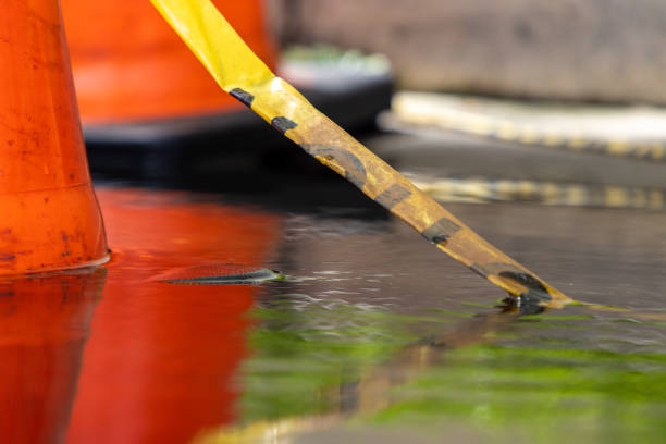 istock Caution tape submerged in flood 1402506757