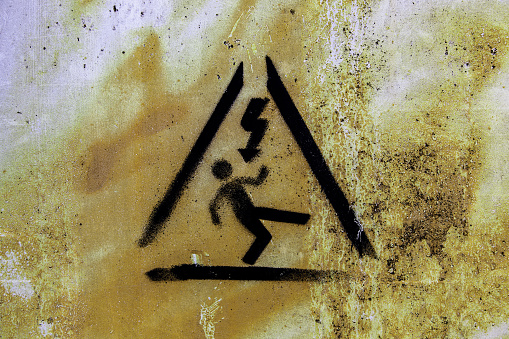 Detail of danger sign, caution