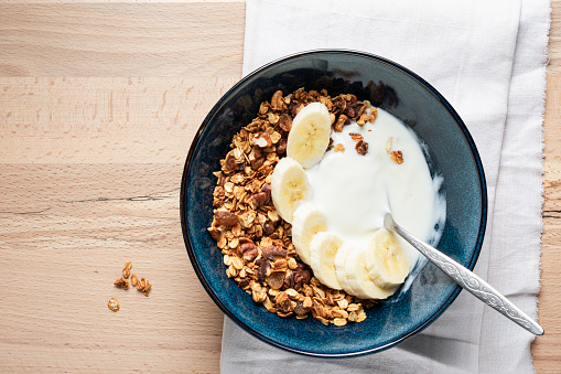 Homemade granola with Greek yogurt and banana.