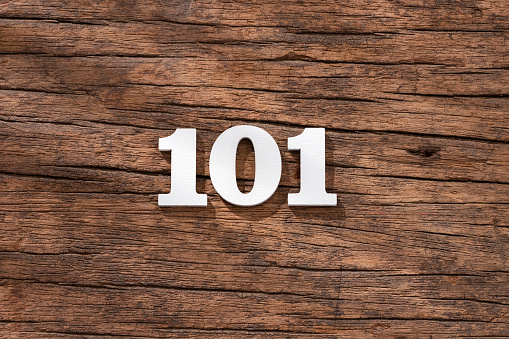 Number 101 - piece on rustic wood background