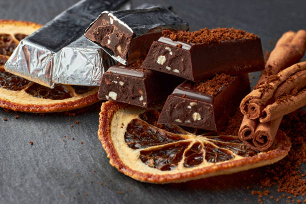 istock Dark chocolate with crushed almonds, cocoa powder, dried orange slices 1402511372
