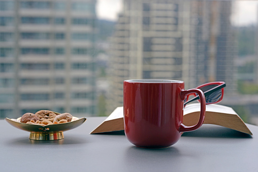 Having a cup of coffee and snacks on the balcony