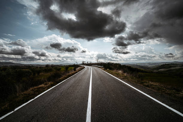 istock Asphalt road at stormy weather 1402514269