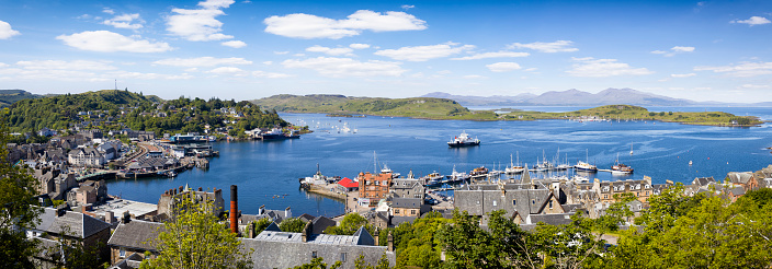 Holidays in Scotland - a panoramic view of Oban with the Isle of Mull in the distance on the west coast of Scotland