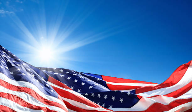 Close up group of American flags and sunlight stock photo