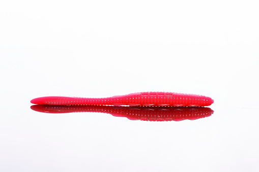 red fishing lure made of silicone. Bait for fishing. Fisherman's equipment