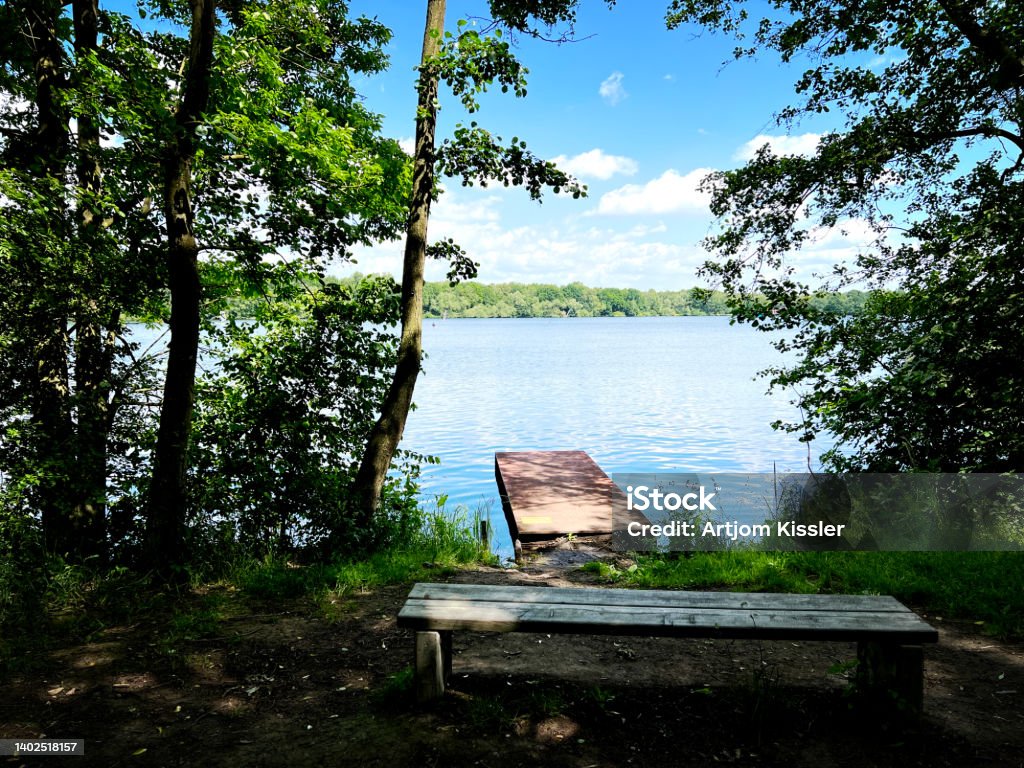 A jetty on the lake with the name "Stadtwaldsee" in the city "Bremen". Public Park Stock Photo