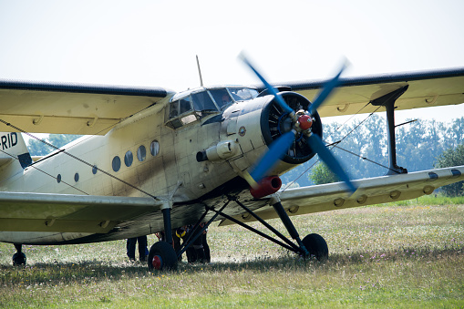 Sobeslav, Czech Republic - July 2020: An old big propeller plane takes off on the airport meadow. Biplane for soldiers.