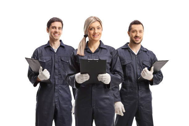 istock Female and two male workers in overall uniforms 1402519325