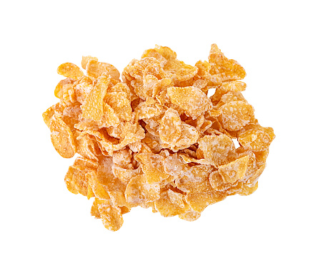 Heap of cornflakes isolated on white background. Top view