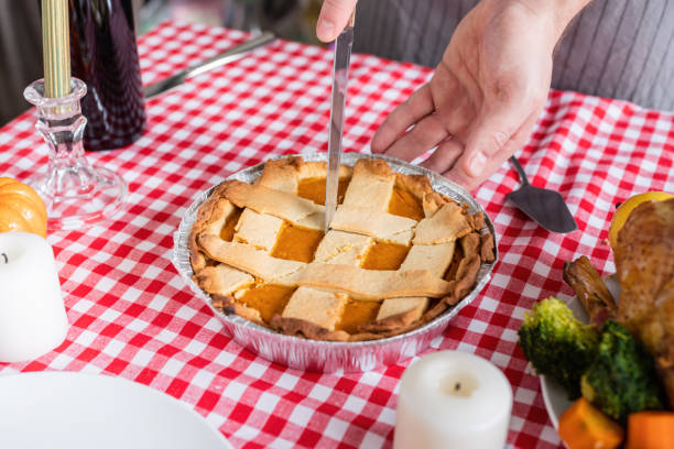 istock woman preparing thanksgiving dinner at home kitchen 1402521462