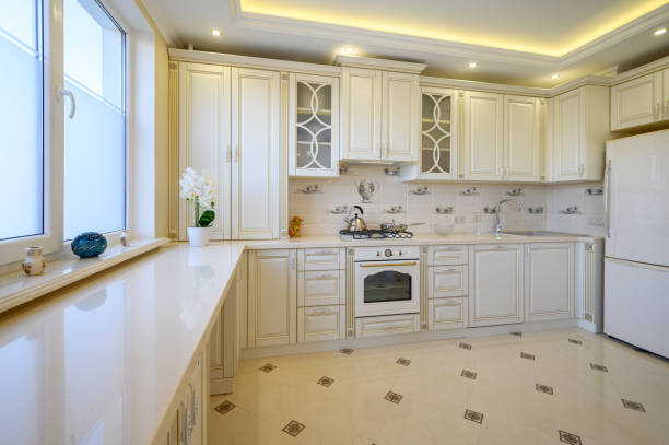 istock Classic white and beige large luxurious kitchen in studio apartment 1402522353
