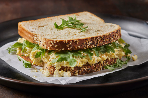 Classic Creamy Egg Salad Sandwich with Baby Arugula on Whole Grain Bread