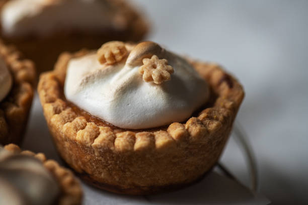 istock Lemon curd tartlets with whipped meringue. Close up. 1402524615