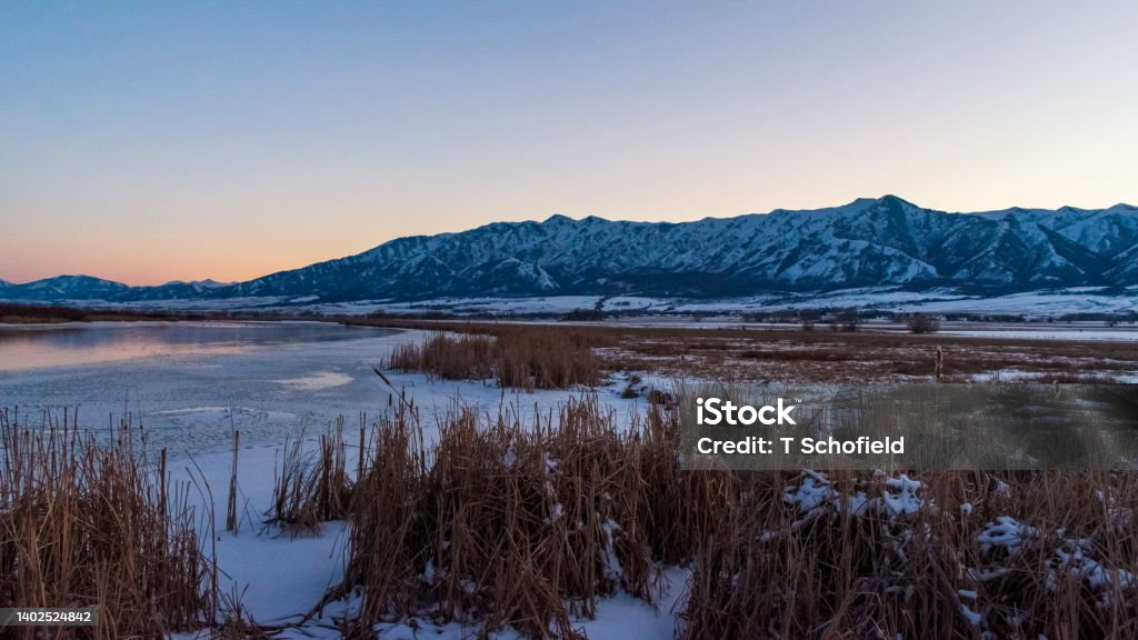Beautiful Sunset Over Little Bear River, Utah Beautiful sunset over frozen Little Bear River, Logan, Utah, USA Logan - Utah Stock Photo