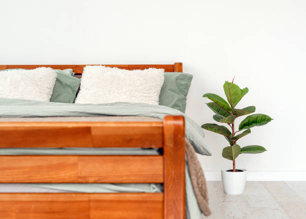 istock Wooden bed in interior 1402526905