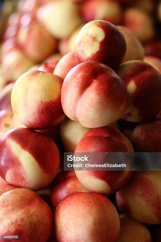 White Peaches White peaches at the farmers market.  Shallow DOF. Focus is on center peach. White Peach Stock Photo