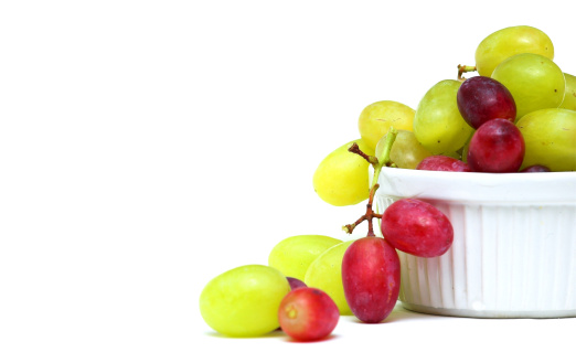 Bowl of Mixed Grapes against a white background
