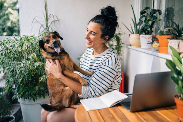 istock Woman Holding Her Dog 1402529054