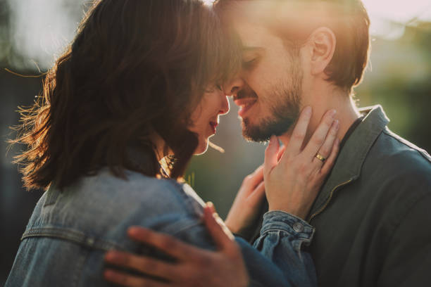 istock Smiling Couple Sharing A Romantic Moment Outdoors 1402529511