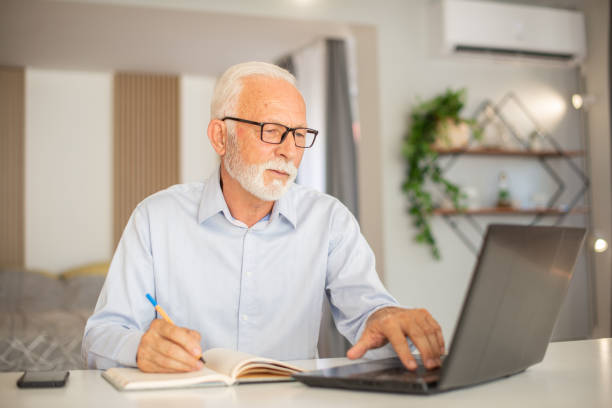 istock Senior businessman working from home 1402529541