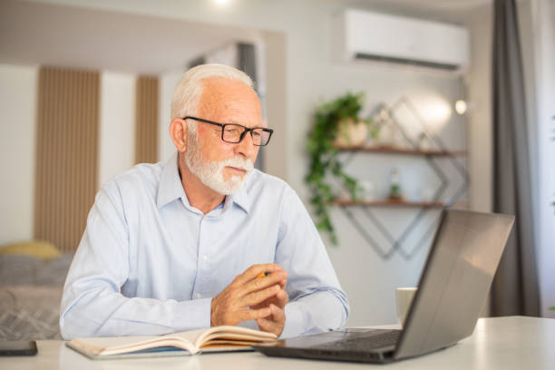 istock Businessman looking busy working from home 1402529549