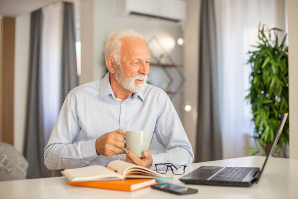 istock Businessman looking busy working from home 1402529574