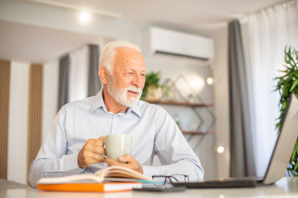 istock Businessman looking busy working from home 1402529578