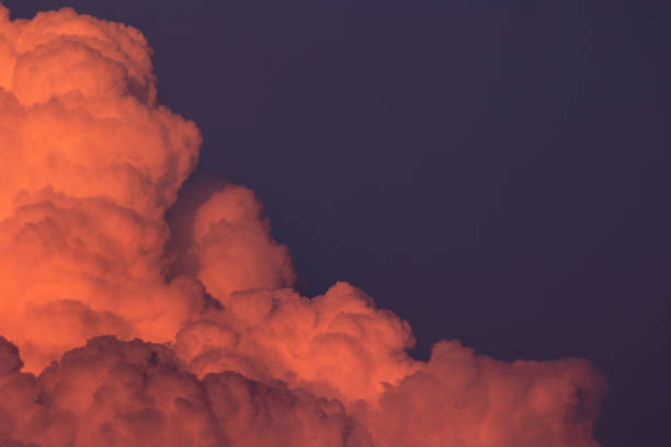 istock Red summer cumulus sunset clouds close up details 1402532026