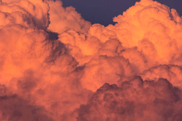 istock Red summer cumulus sunset clouds close up details 1402532027