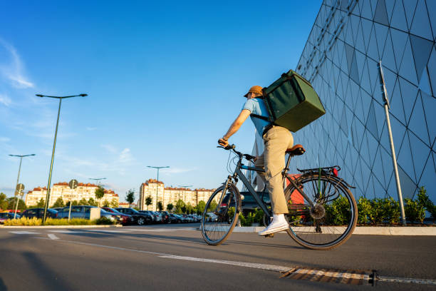 istock Delivery person riding bicycle 1402535398