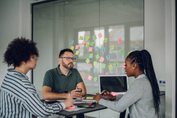 istock Multiracial colleagues having a meeting in the office 1402536351