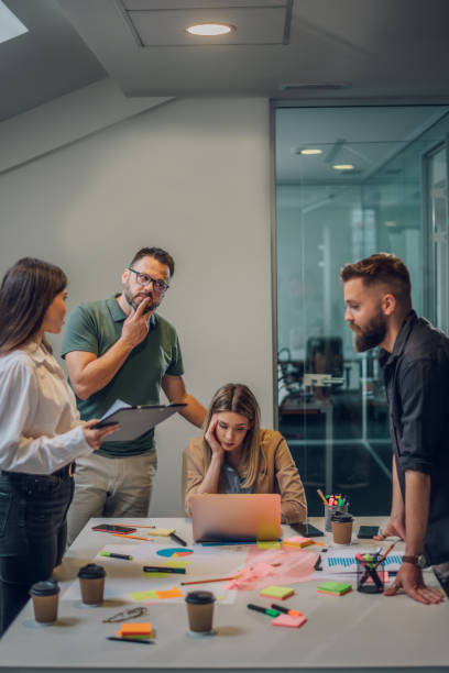 istock Stressed business colleagues having a meeting in an office and solving problems 1402536359