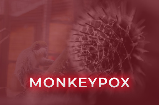 Monkeypox virus. Red background. Outbreak concept. Virus transmitted to humans from animals. Monkeys may harbor the virus and infect people. New pandemic. Word monkeypox. Blurred. Molecular. Illness.