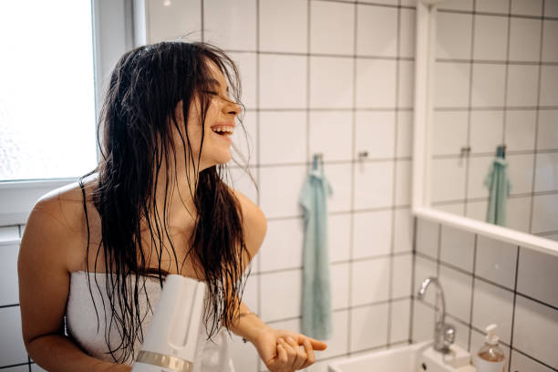 istock Beauty is using hairdryer 1402536789