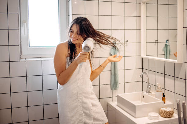istock Beauty is using hairdryer 1402537304
