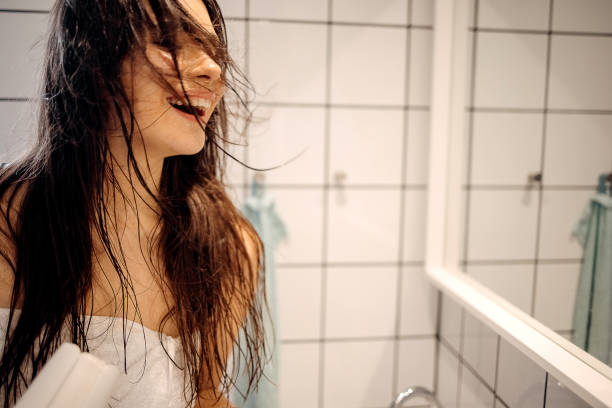istock Beauty is using hairdryer 1402537383